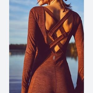Free People movement NWOT cross back long sleeve jumpsuit size XS
